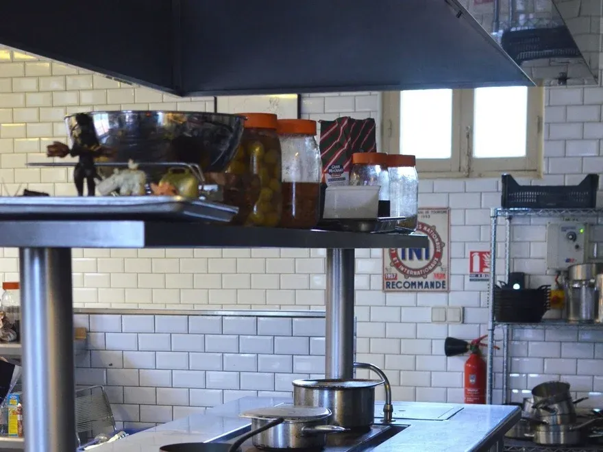 Stainless steel benches and fittings in a commercial kitchen before a strip out.